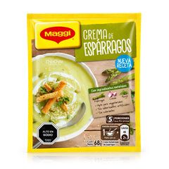 Un paquete de Maggi Crema de Espárragos en su envase amarillo original, con un plato de sopa verde en la parte delantera.