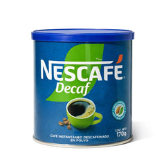 Lata de café Nescafé Descafeinado con tapa azul y detalles en verde sobre fondo blanco.