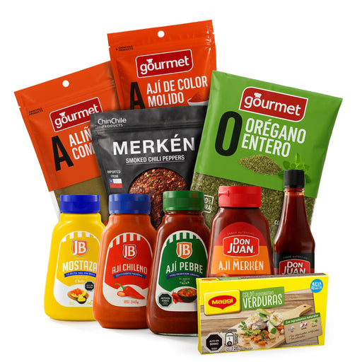 Surtido de productos gourmet, incluyendo salsas, especias y una caja de aperitivos sobre fondo blanco.