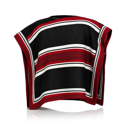 Traditional Chilean Huaso Manta laid flat, a black huaso poncho with red and white stripes and a red border on all four sides.