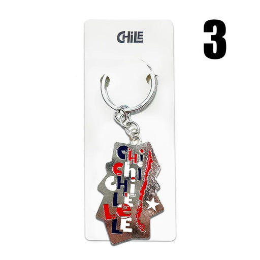 Metal keychain with stylized text "Chile" and Chilean map outline in red, white, and blue.