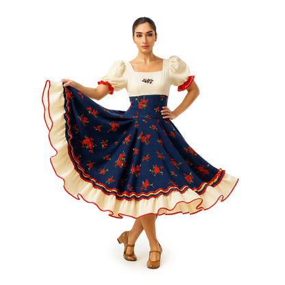 Woman wearing the Traditional Navy Floral Vestido Huasa Chinita, a Chilean cueca dress with a cream bodice and navy skirt printed with red roses.
