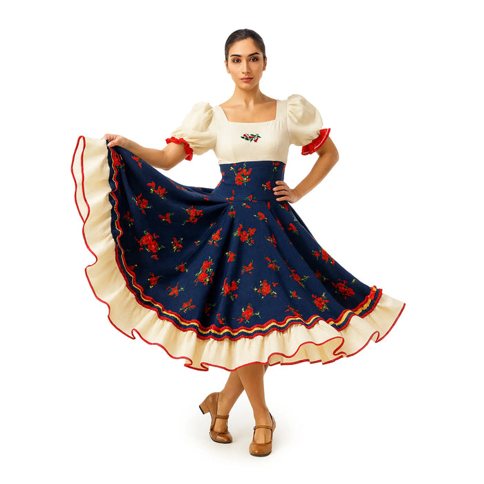 Woman posing in Vestido Huasa Chinita traditional Chilean dress with cream bodice and navy skirt decorated with red roses.