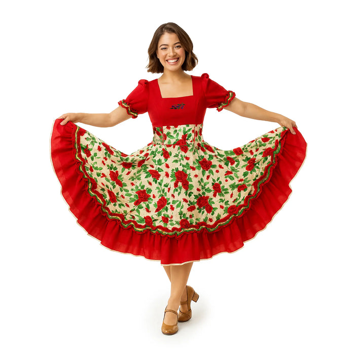 Young woman wearing Vestido Huasa Chinita traditional Chilean dress with red bodice and white floral skirt, smiling and holding the skirt open.