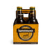 Kunstmann miel beer bottles in a four-pack cardboard box on a white background