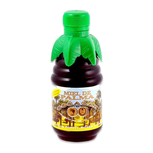 A 330 gram bottle of honey with a green leaf shaped top cap and a yellow label with trees on it.