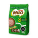 Green Nestle Milo packaging with a cup of chocolate and wheat elements on a white background