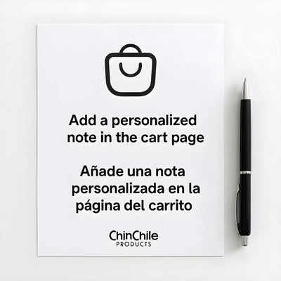 White sheet of paper with a black pen beside it, displaying the message "Add a personalized note in the cart page" and its Spanish translation "Añade una nota personalizada en la página del carrito.