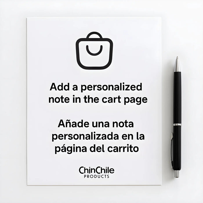 White sheet of paper with a black pen beside it, displaying the message "Add a personalized note in the cart page" and its Spanish translation "Añade una nota personalizada en la página del carrito.