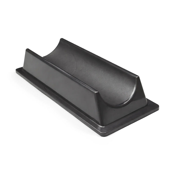 Black plastic component on a white background