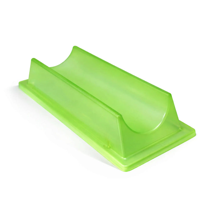 Green plastic tool on a white background