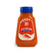 Bottle of J&B Aji Chileno sauce with a blue cap on a white background