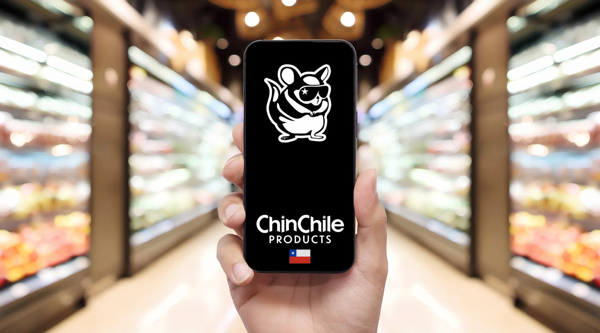 ChinChile Products mascot logo on smartphone held in grocery store aisle with blurred food shelves.