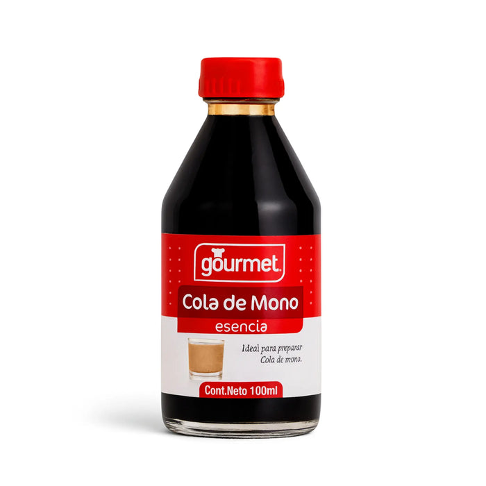 A clear glass bottle of Esencia Cola de Mono with a red cap and label on a white background.
