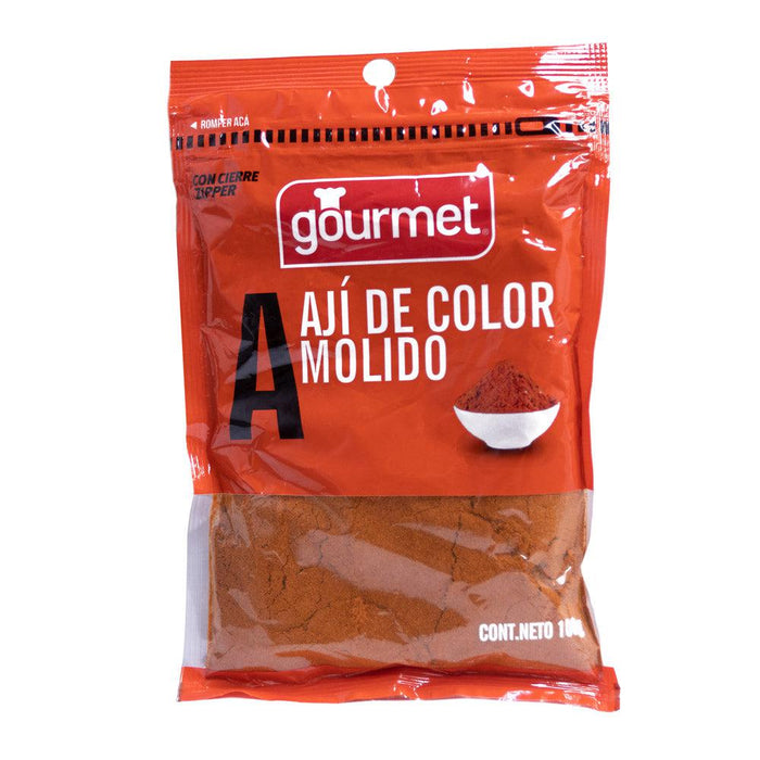 A bright orange 100 gram packet of Ají de color by Gourmet