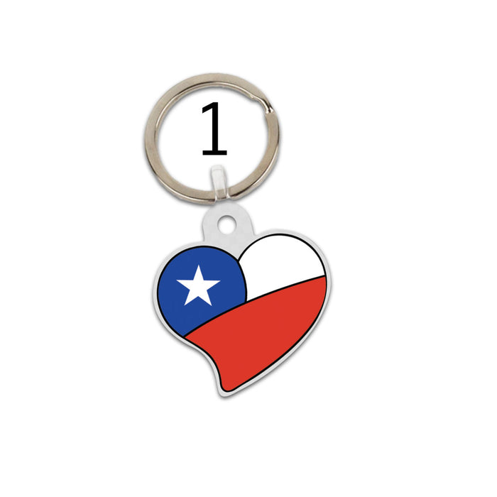 A small heart shaped keychain with a Chilean flag design.