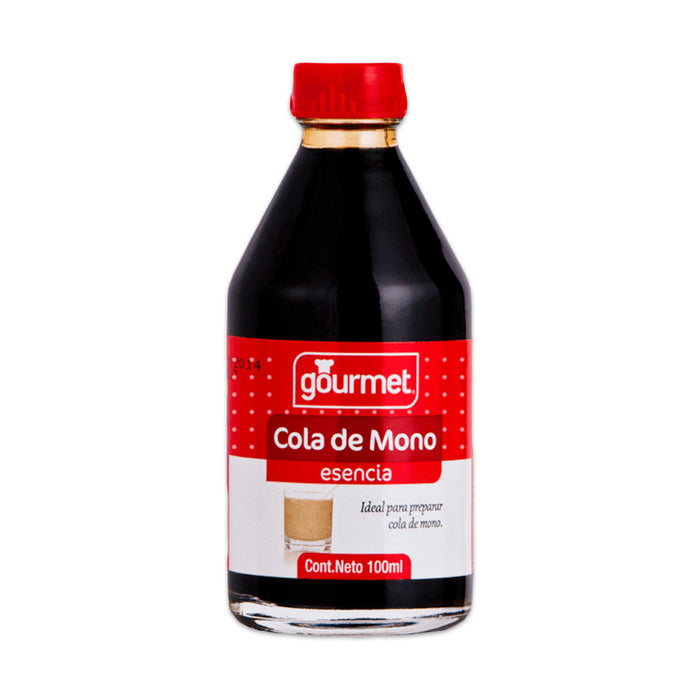 A clear glass bottle of Esencia Cola de Mono with a red cap and label.