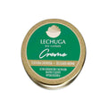 Un bote verde y dorado de crema facial y corporal de lechuga.