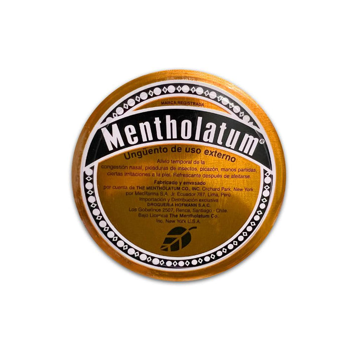 A small orange and gold tin of Mentholatum imported from Chile.